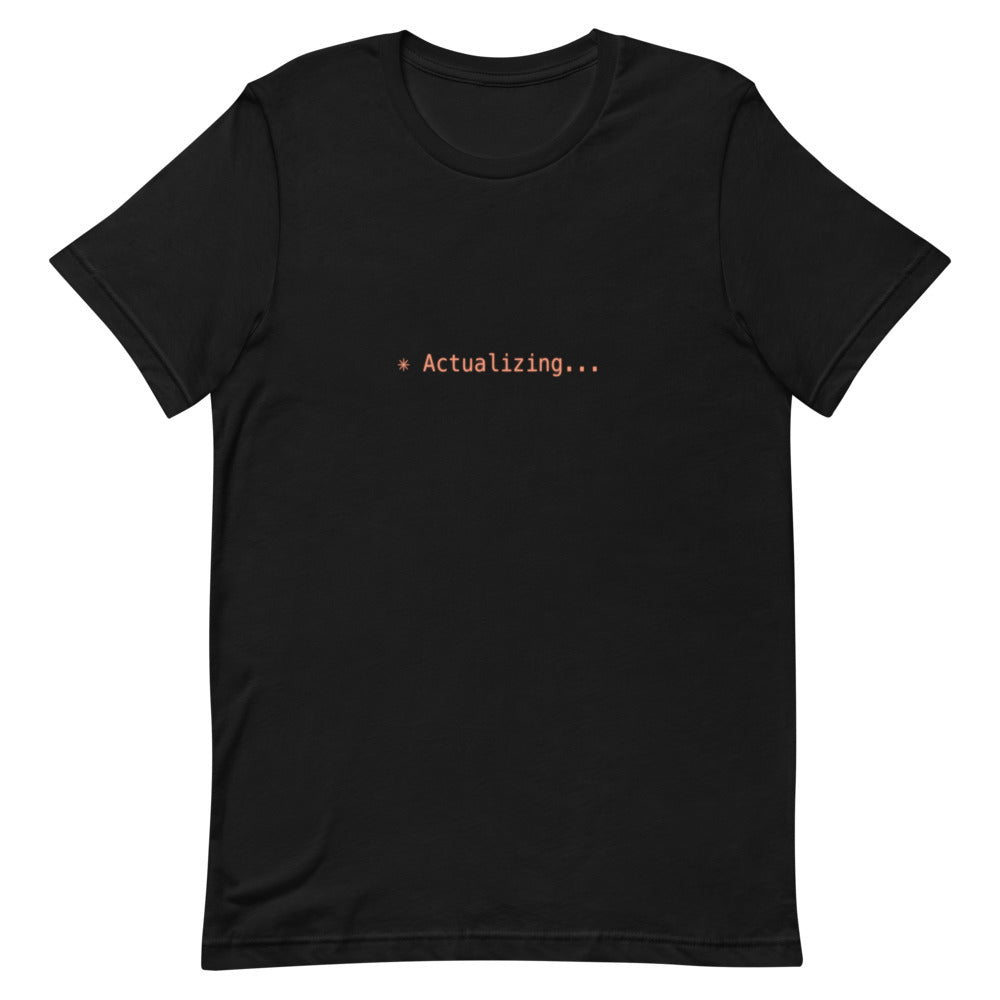 Flat lay of black t-shirt with ✳ Actualizing... design
