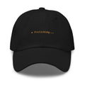 Claude Code Spinner Dad Hat - Frolicking - Black dad hat with orange embroidered text