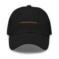 Claude Code Spinner Dad Hat - Metamorphosing - Black dad hat with orange embroidered text