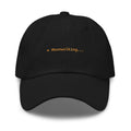 Claude Code Spinner Dad Hat - Moonwalking - Black dad hat with orange embroidered text