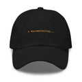 Claude Code Spinner Dad Hat - Razzmatazzing - Black dad hat with orange embroidered text