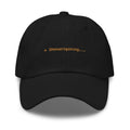 Claude Code Spinner Dad Hat - Shenaniganing - Black dad hat with orange embroidered text