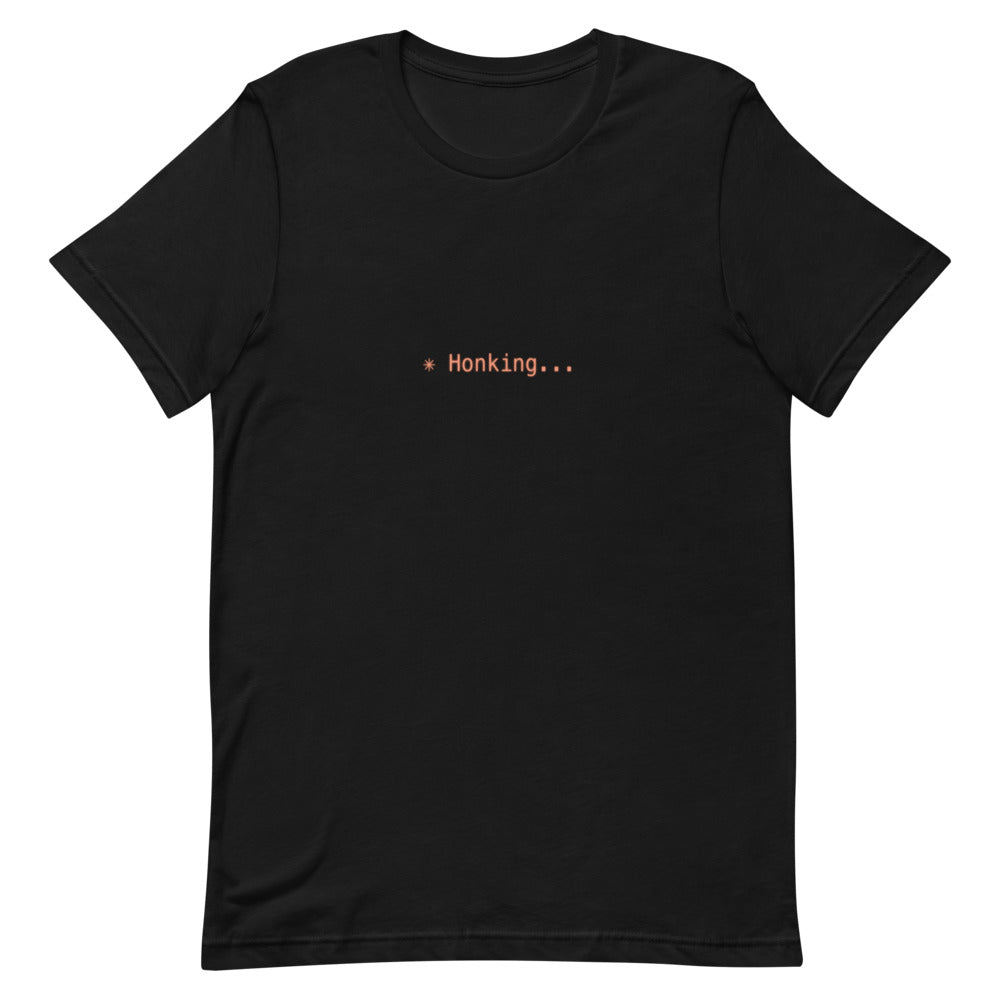 Flat lay of black t-shirt with ✳ Honking... design