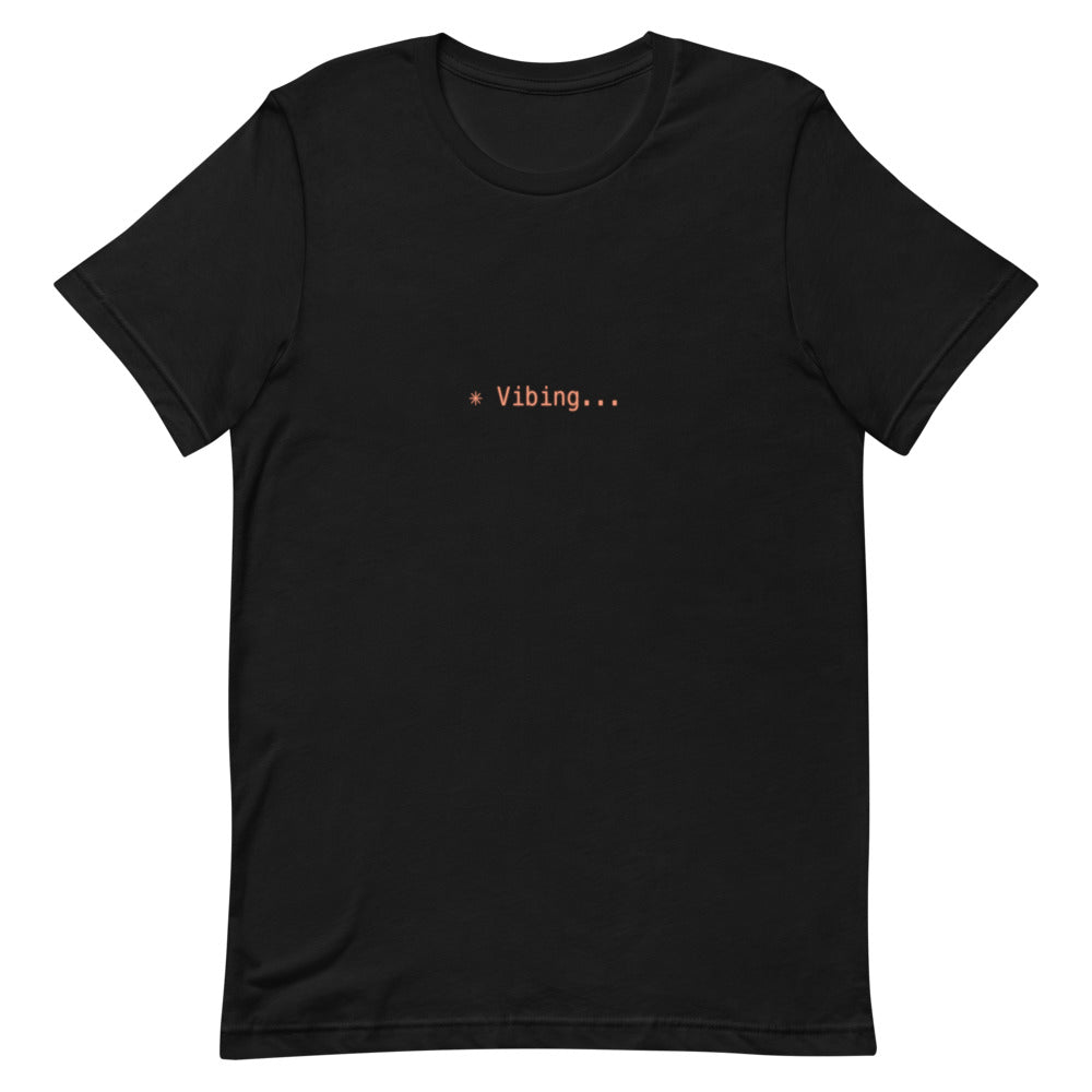Flat lay of black t-shirt with ✳ Vibing... design